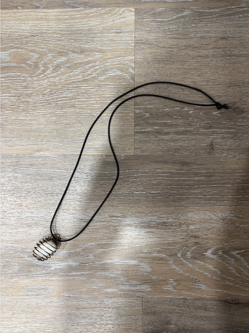 Antique Brass-Tone Spiral Cage Pendant on Black Cord Necklace